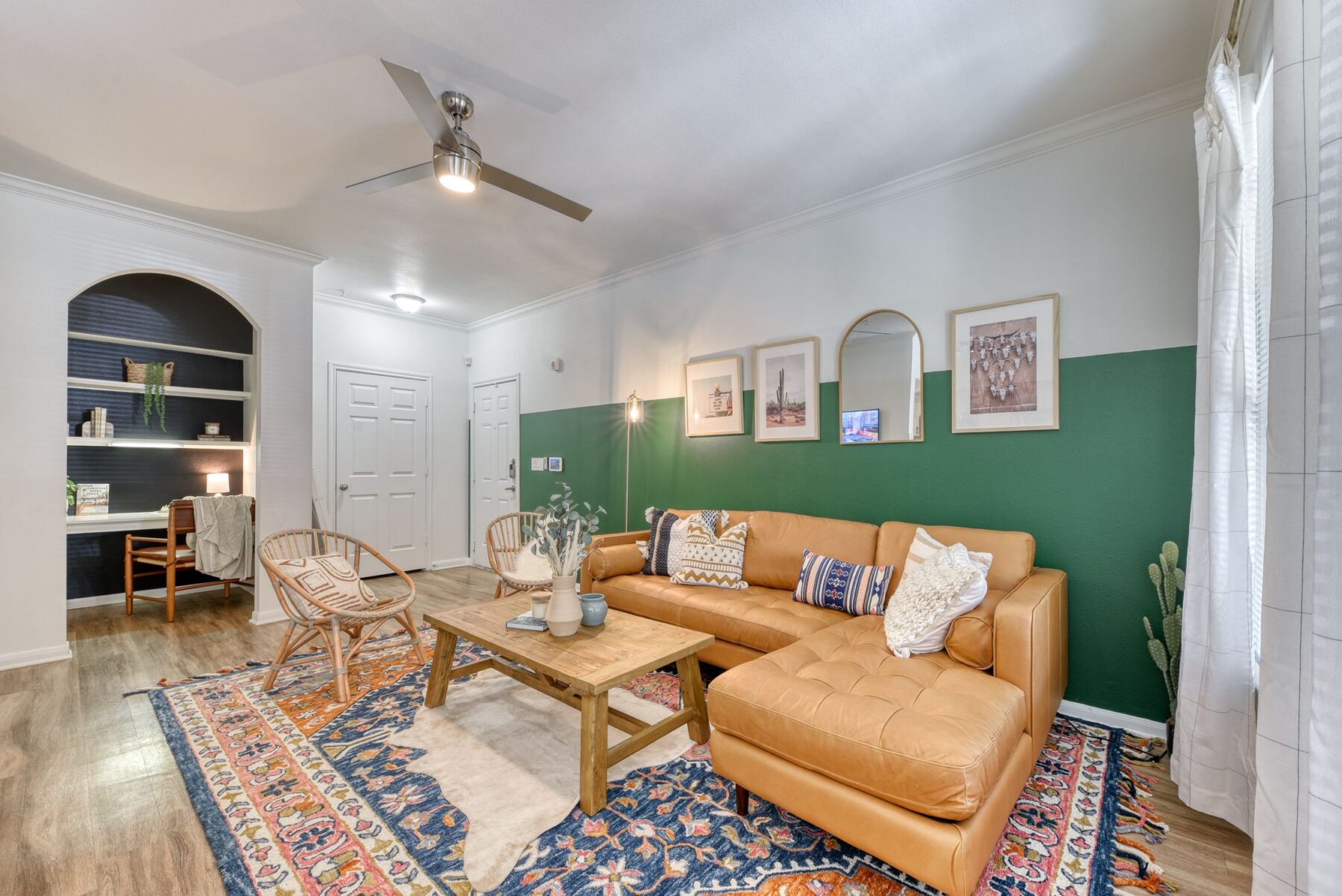 Living room with built in desk and shelves