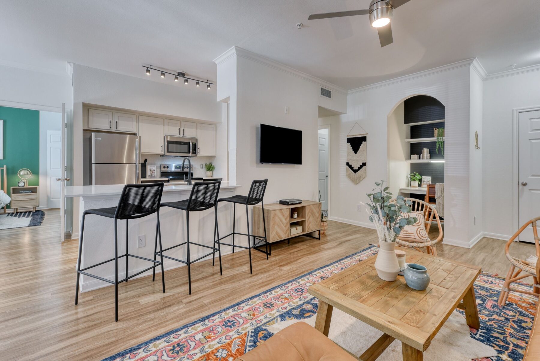 Open-concept living room and kitchen at San Miguel luxury apartments in San Antonio