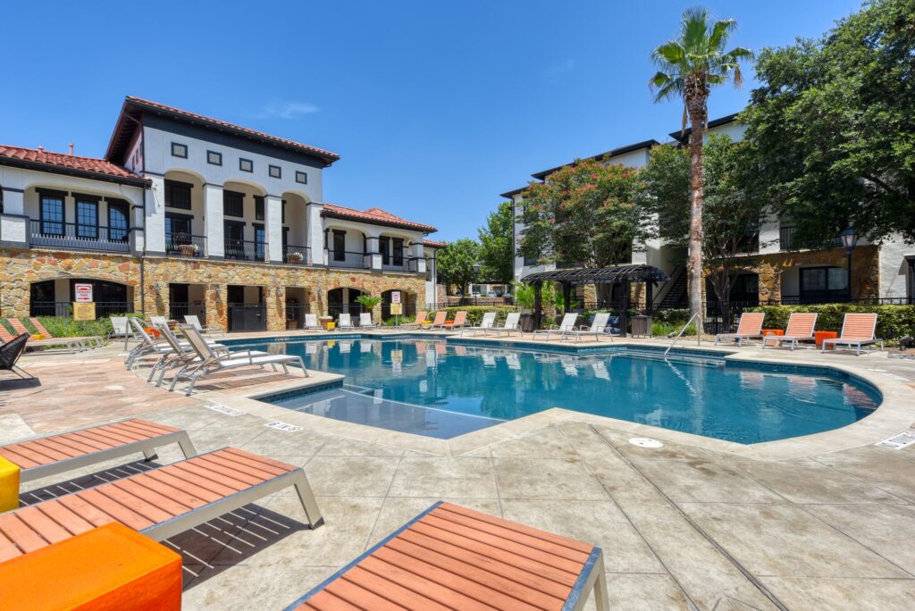 Swimming Pool with deck seating and shaded pavilions