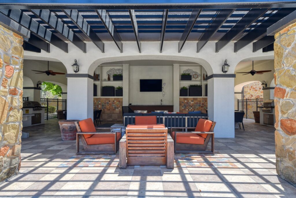 covered pavilion with grills and sofas