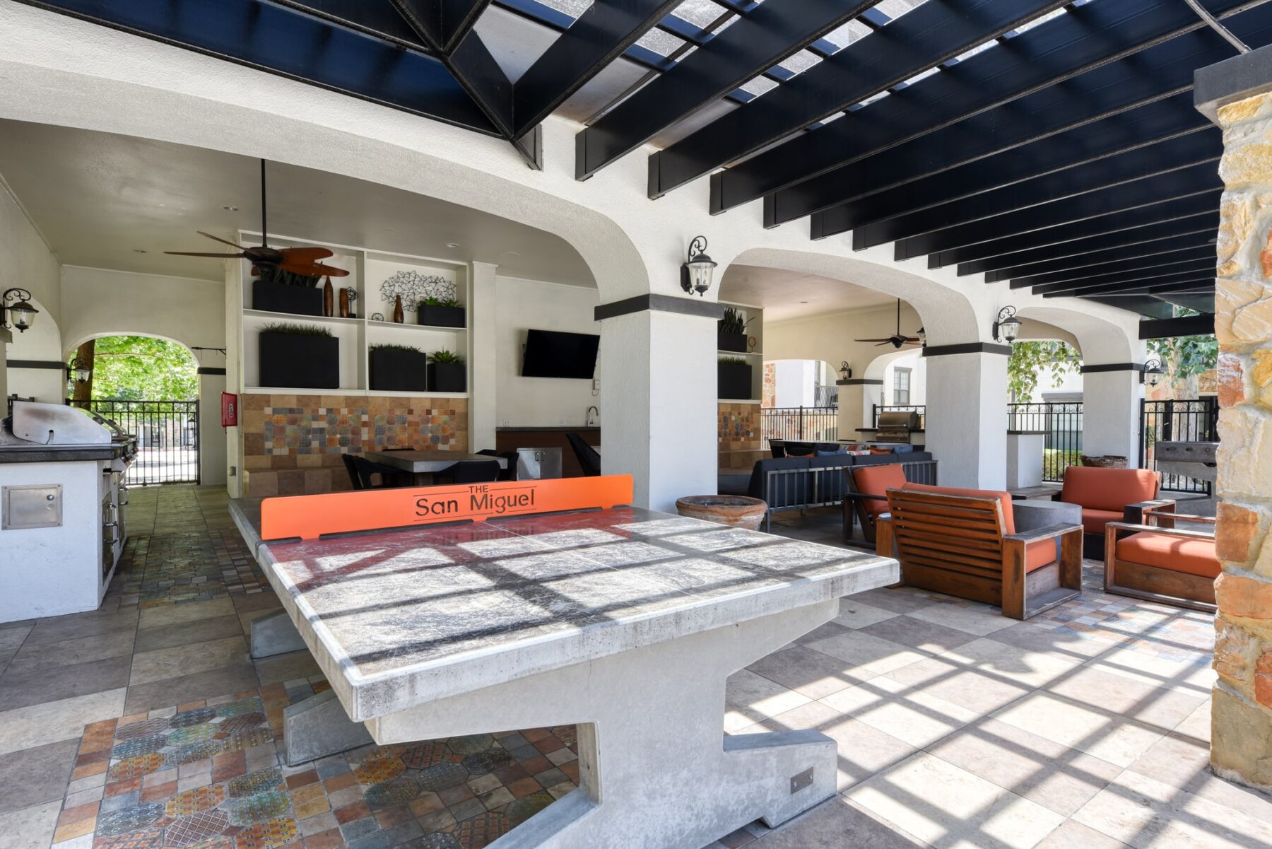 covered pavilion with grills and ping pong table