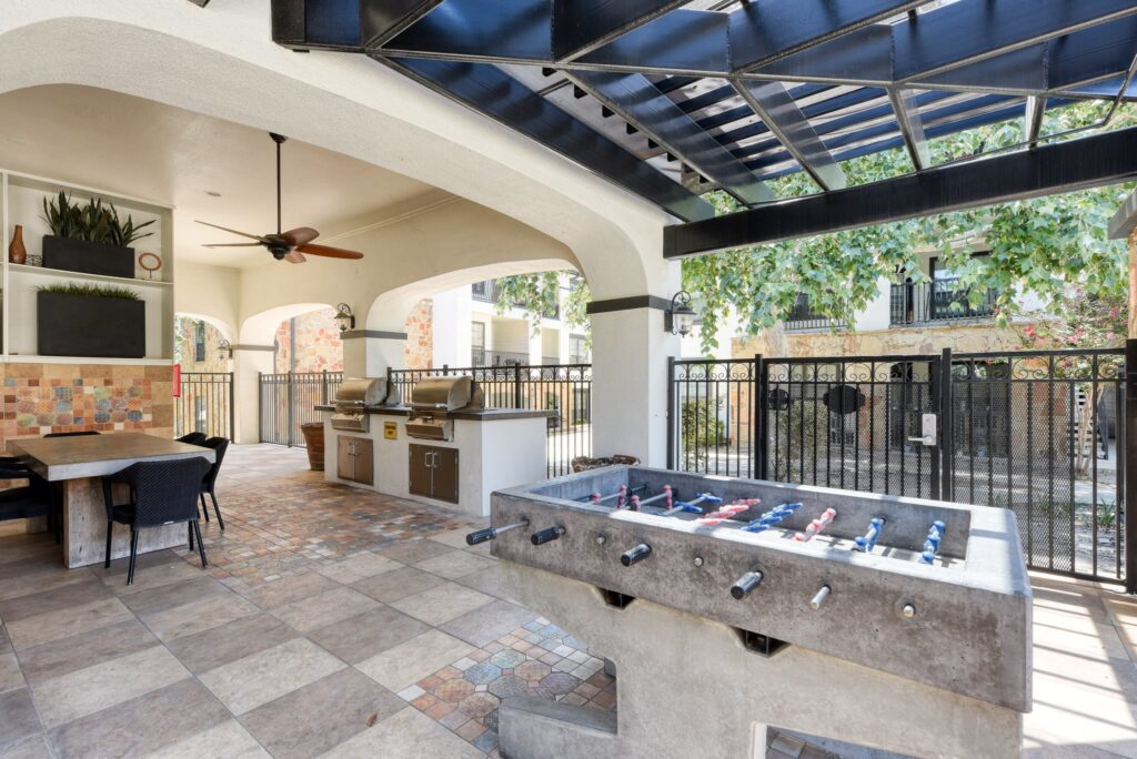 Community Area with a foos ball and grilling station