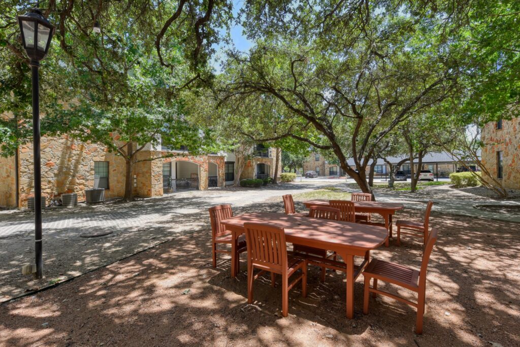 Outdoor dining area at the San Miguel apartments near Shavano Park in San Antonio